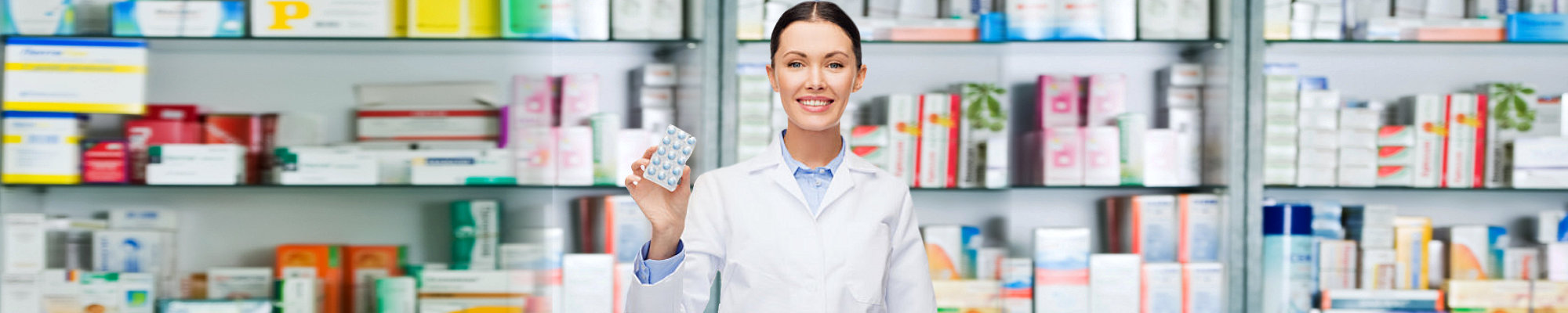 Portrait of a female pharmacist showing pills